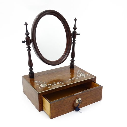 1736 - A 20thC rosewood dressing mirror with two turned upright supports above an inlaid top and having a s... 