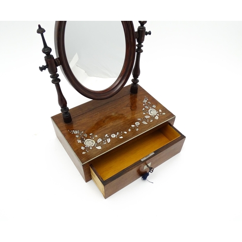 1736 - A 20thC rosewood dressing mirror with two turned upright supports above an inlaid top and having a s... 