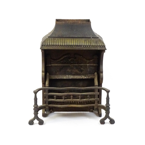 1746A - A mid 20thC cast iron open fireplace, comprising one-piece fire box, back, grate and smoke shelf wit... 