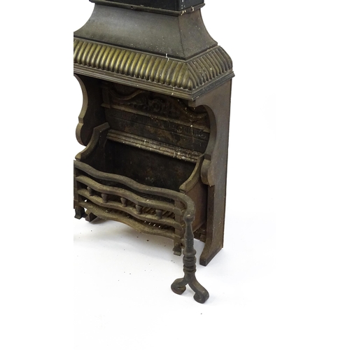 1746A - A mid 20thC cast iron open fireplace, comprising one-piece fire box, back, grate and smoke shelf wit... 