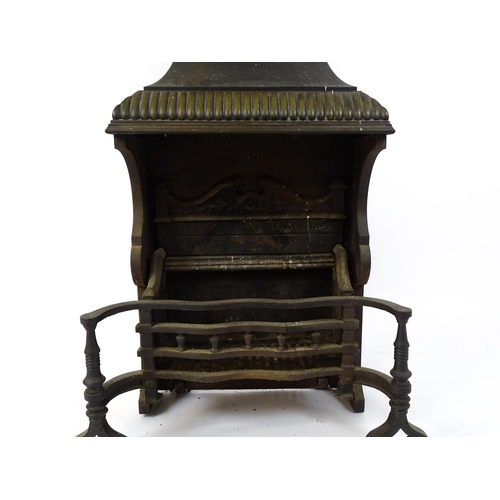 1746A - A mid 20thC cast iron open fireplace, comprising one-piece fire box, back, grate and smoke shelf wit... 