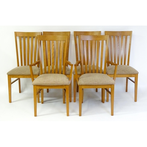 1749 - A set of six G-plan dining chairs with fanned, slatted backrests raised on four tapering straight le... 