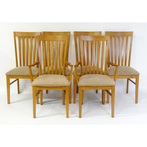 1749 - A set of six G-plan dining chairs with fanned, slatted backrests raised on four tapering straight le... 