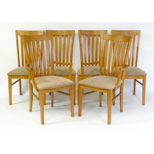 1749 - A set of six G-plan dining chairs with fanned, slatted backrests raised on four tapering straight le... 