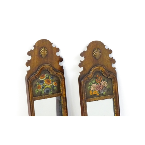 1755 - A pair of Georgian style walnut wall mirrors with shaped tops, applied shell motifs, heavily moulded... 