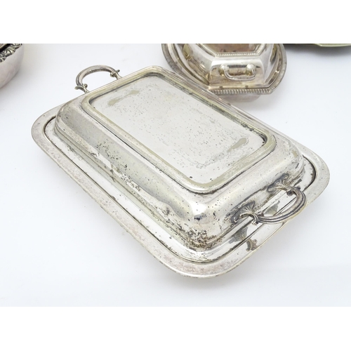 517 - A quantity of 19thC and later silver plate items to include a large twin handled tray, entree dishes... 