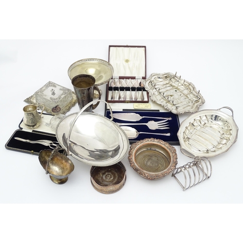 518 - A quantity of silver plate items to include cake basket, bottle coasters, asparagus dishes, butter d... 