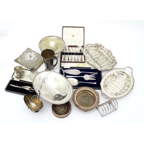 518 - A quantity of silver plate items to include cake basket, bottle coasters, asparagus dishes, butter d... 