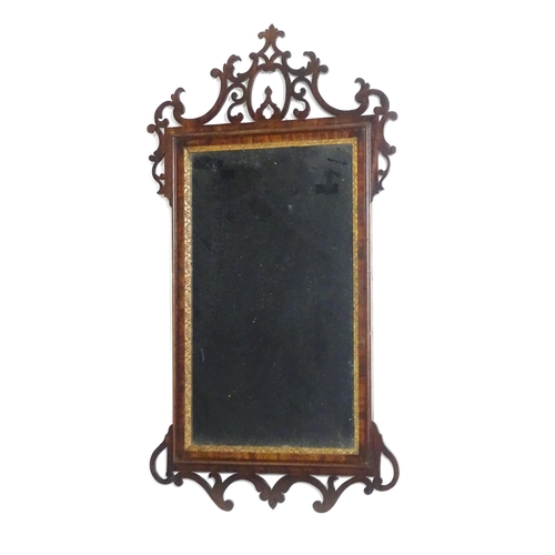 1557 - A late 18thC mahogany wall mirror with pierced fretwork and crossbanded detail. Approx. 39