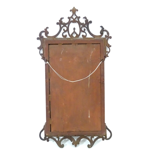 1557 - A late 18thC mahogany wall mirror with pierced fretwork and crossbanded detail. Approx. 39