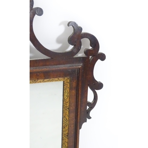 1557 - A late 18thC mahogany wall mirror with pierced fretwork and crossbanded detail. Approx. 39