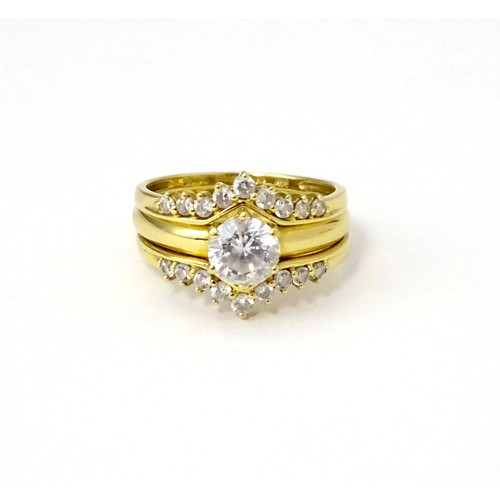 563 - Three 14ct gold rings set with white stones to be worn together. Ring size approx. R 1/2 (3)