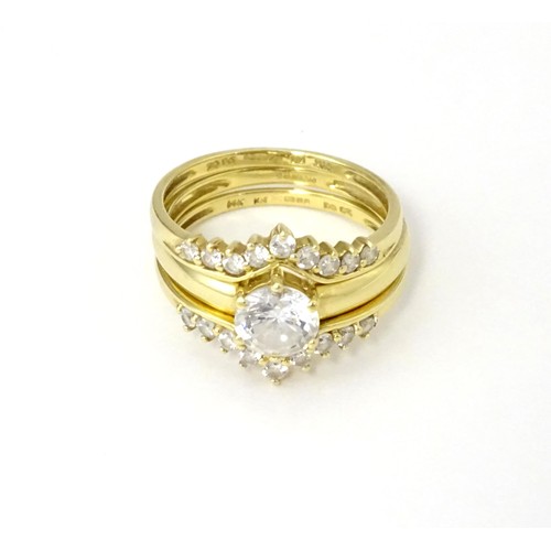 563 - Three 14ct gold rings set with white stones to be worn together. Ring size approx. R 1/2 (3)