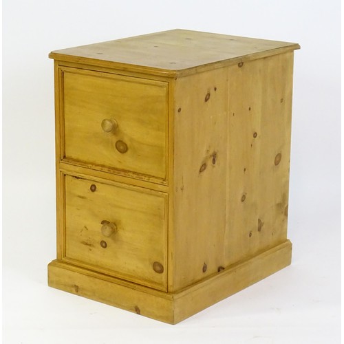 26 - A late 20thC pine filing cabinet. 28