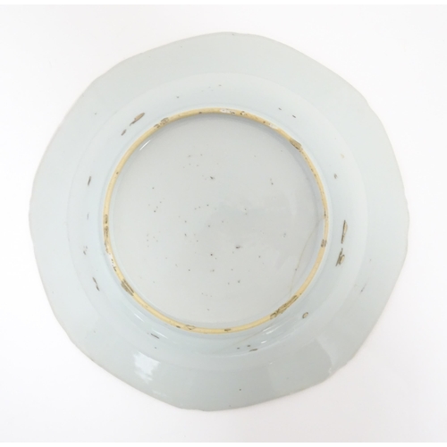 55 - A Chinese blue and white dish with floral and foliate decoration. Approx. 8 3/4