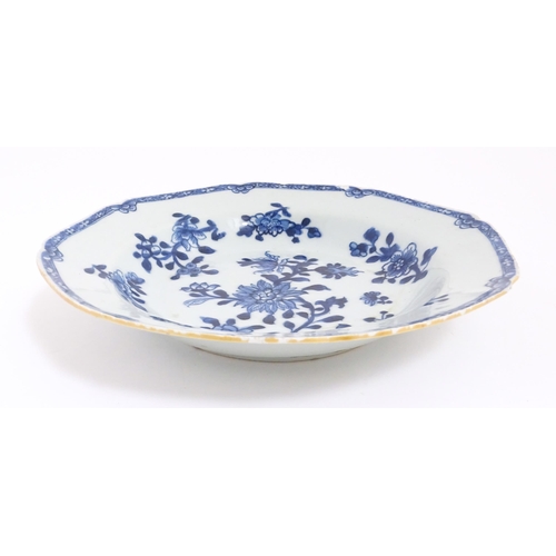 55 - A Chinese blue and white dish with floral and foliate decoration. Approx. 8 3/4