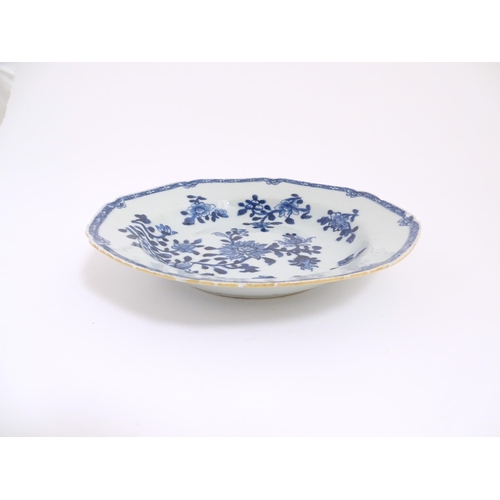 55 - A Chinese blue and white dish with floral and foliate decoration. Approx. 8 3/4