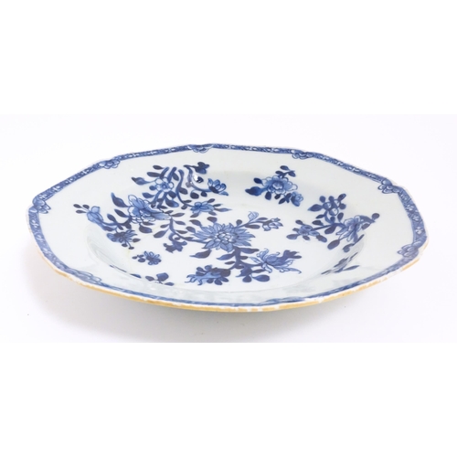 55 - A Chinese blue and white dish with floral and foliate decoration. Approx. 8 3/4