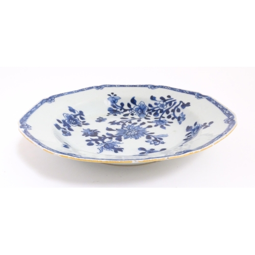 55 - A Chinese blue and white dish with floral and foliate decoration. Approx. 8 3/4