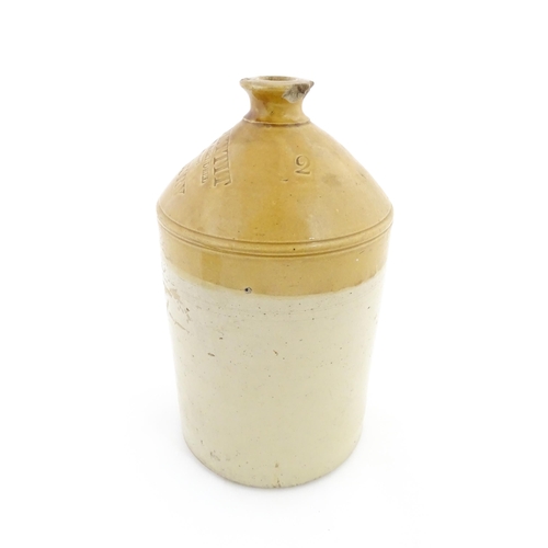 78 - An early 20thC two tone stoneware flagon marked James Pettit, Successor to Robert Dell Wine & Spirit... 