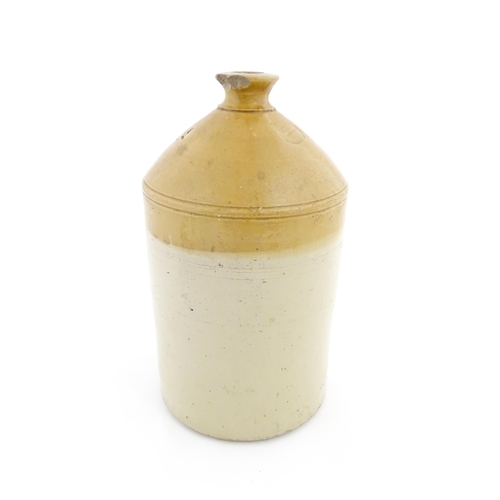 78 - An early 20thC two tone stoneware flagon marked James Pettit, Successor to Robert Dell Wine & Spirit... 