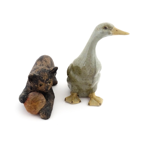 113 - A Chinese model of a duck with a celadon style glaze. Together with a Bretby model of a kitten / cat... 