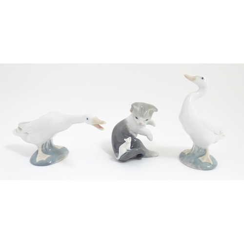 127 - Three Lladro animals comprising Cat with Mouse, Honking Goose and Duck. With boxes. Goose approx. 6