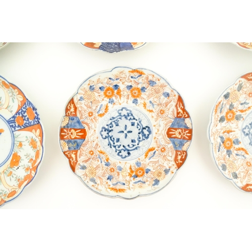 129 - Six assorted Japanese plates with scalloped edges decorated in the Imari palette with flowers and fo... 