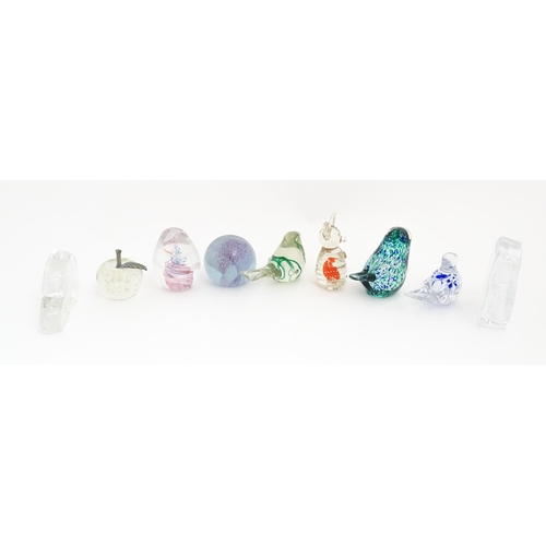 131 - A quantity of assorted glass paperweights to include examples modelled as birds etc. makers includin... 