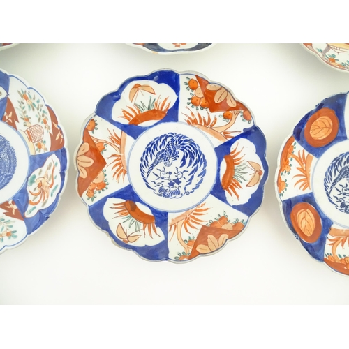 133 - Six assorted Japanese plates with scalloped edges decorated in the Imari palette with flowers, folia... 