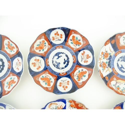 133 - Six assorted Japanese plates with scalloped edges decorated in the Imari palette with flowers, folia... 