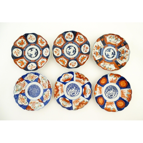 133 - Six assorted Japanese plates with scalloped edges decorated in the Imari palette with flowers, folia... 