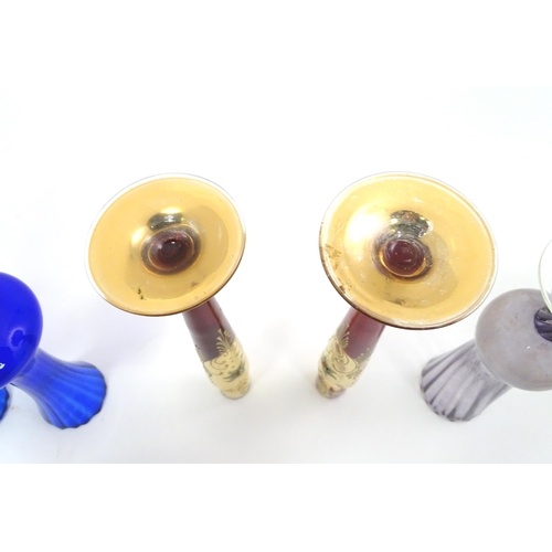 301 - A quantity of assorted glassware to include pedestal blue glass vases, candlesticks, decanters, pede... 