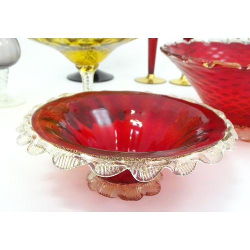 301 - A quantity of assorted glassware to include pedestal blue glass vases, candlesticks, decanters, pede... 