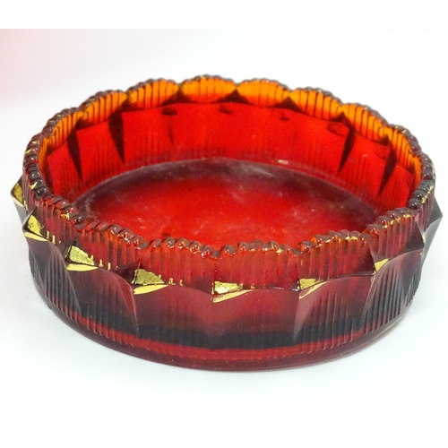 301 - A quantity of assorted glassware to include pedestal blue glass vases, candlesticks, decanters, pede... 