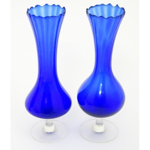 301 - A quantity of assorted glassware to include pedestal blue glass vases, candlesticks, decanters, pede... 