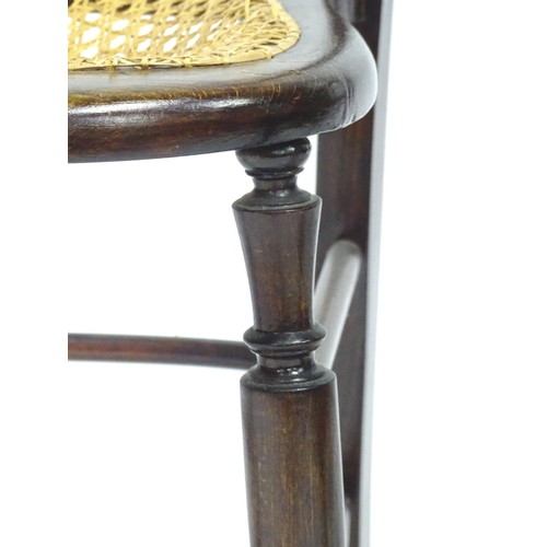 318 - Three early 20thC beech chairs with turned decoration, each approx 32 1/2