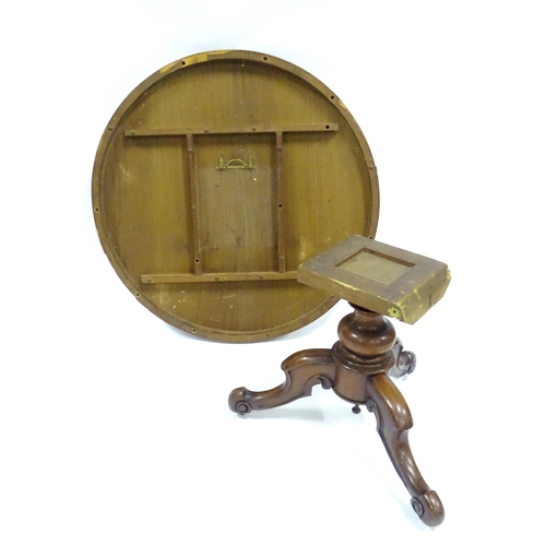 332 - A Victorian mahogany tilt-top breakfast table, the circular top supported by a turned baluster above... 