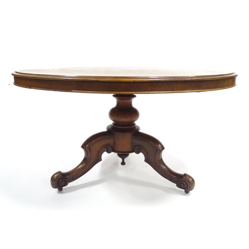 332 - A Victorian mahogany tilt-top breakfast table, the circular top supported by a turned baluster above... 