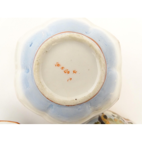 336 - Three Japanese pots and covers decorated in the Satsuma palette with figures, Mount Fuji landscapes,... 