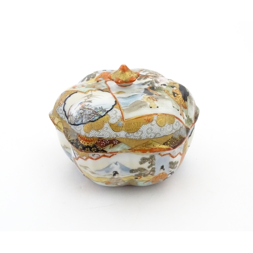 336 - Three Japanese pots and covers decorated in the Satsuma palette with figures, Mount Fuji landscapes,... 