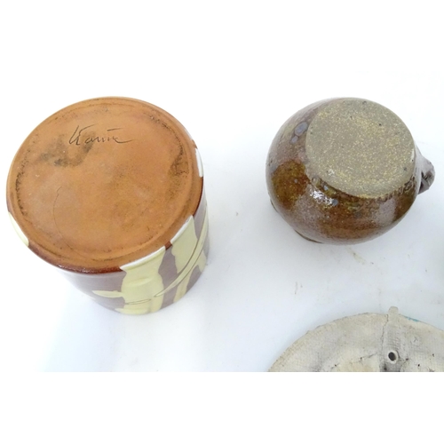 345 - A quantity of studio pottery wares to include a vase / beaker of cylindrical form with slip decorati... 