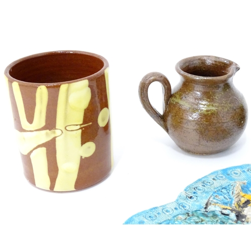 345 - A quantity of studio pottery wares to include a vase / beaker of cylindrical form with slip decorati... 