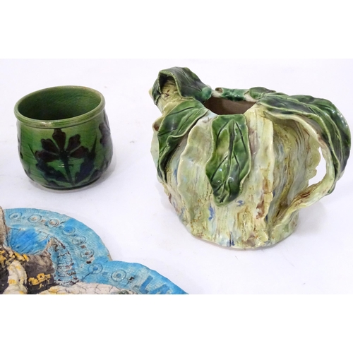 345 - A quantity of studio pottery wares to include a vase / beaker of cylindrical form with slip decorati... 