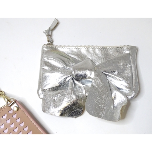 360 - A Kurt Geiger bag with heart detail and an L. K. Bennett purse with bow detail. Largest approx. 9 1/... 