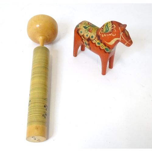 369 - A Japanese turned wooden Kokeshi style doll with painted detail. Together with a wooden model of a h... 