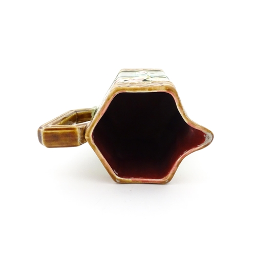 380 - A French Jugendstil / Art Nouveau majolica jug of hexagonal form by Gustave de Bruyn, decorated with... 