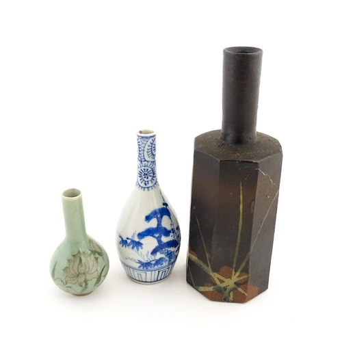389 - A Japanese studio pottery vase with octagonal body, elongated neck and brushwork detail. Together wi... 