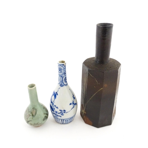 389 - A Japanese studio pottery vase with octagonal body, elongated neck and brushwork detail. Together wi... 