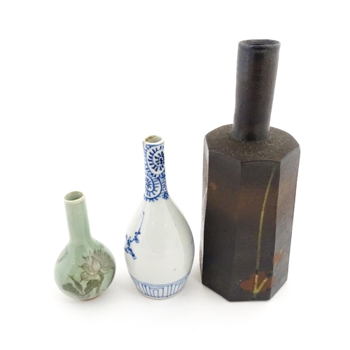 389 - A Japanese studio pottery vase with octagonal body, elongated neck and brushwork detail. Together wi... 